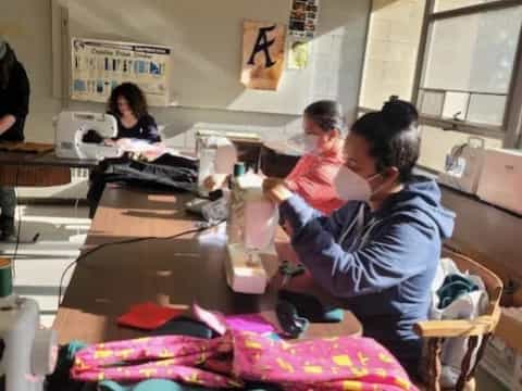 a group of people working in a room
