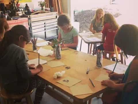 a group of people sitting at a table