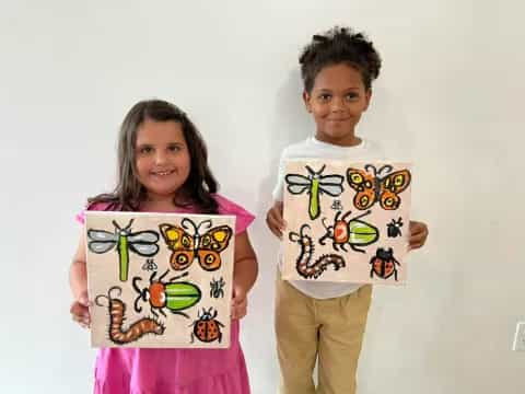 a couple of children holding up signs