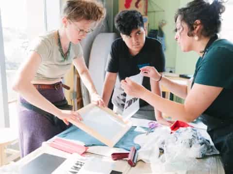 a group of women looking at a piece of paper