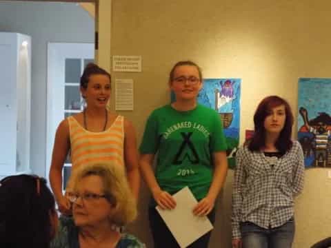 a group of people standing in a room