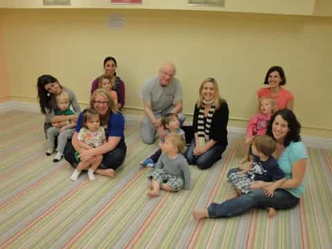 a group of people sitting on the floor