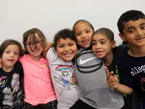 a group of children posing for a photo