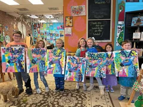 a group of children in colorful dresses