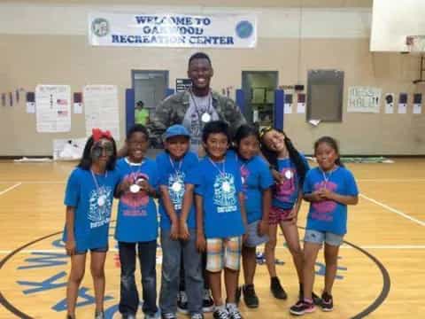 a group of kids posing for a photo