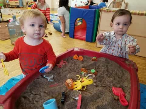 a couple of kids playing with toys