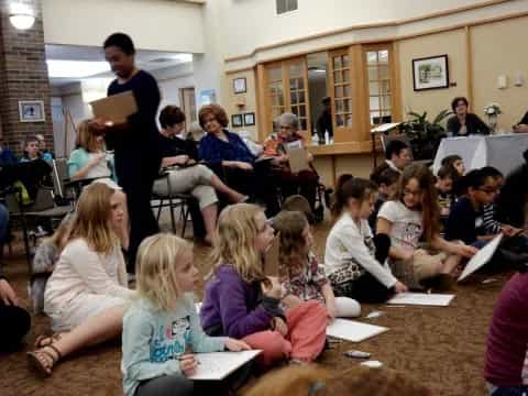 a group of people sitting in a room