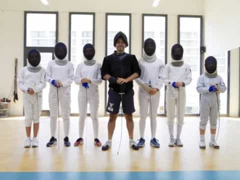 a group of people in karate uniforms