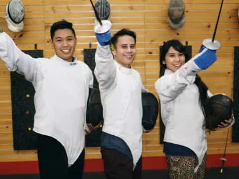 a group of people wearing white outfits