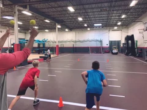 a group of people playing volleyball