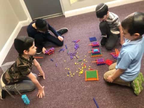 a group of children playing with blocks