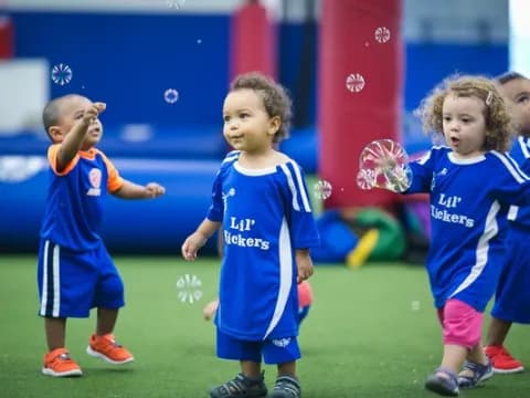 a group of children in blue uniforms