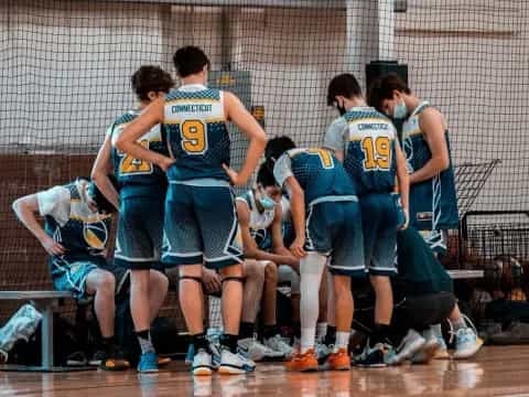 a group of people in sports uniforms