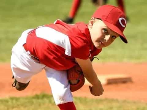 a baseball player in a red uniform