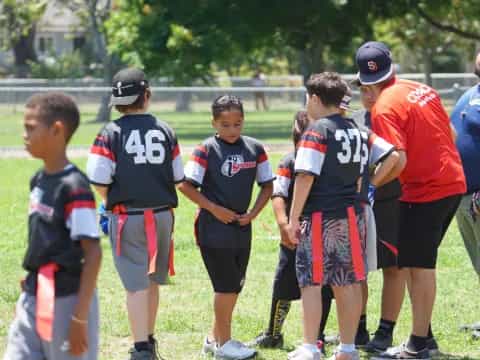 a group of boys standing on a field