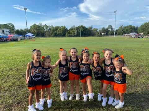 a group of girls in athletic uniforms
