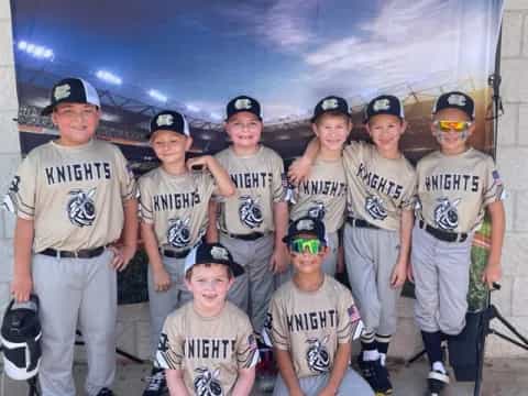 a group of people wearing baseball uniforms