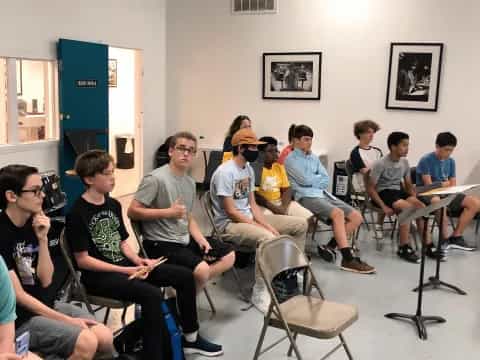 a group of people sitting in chairs