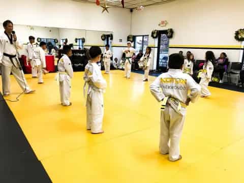 a group of people in karate uniforms