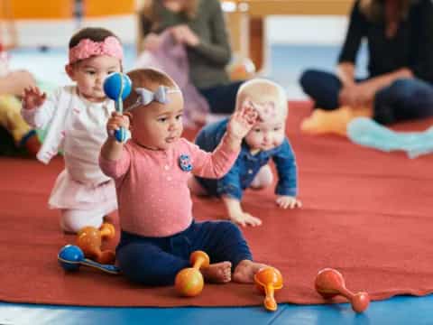 a group of children playing with toys
