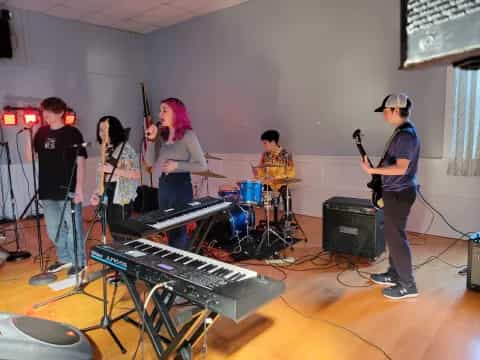 a group of people playing instruments