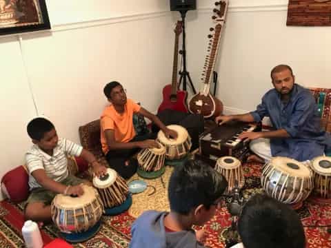 a group of people playing instruments