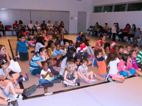 a group of people sitting on the floor