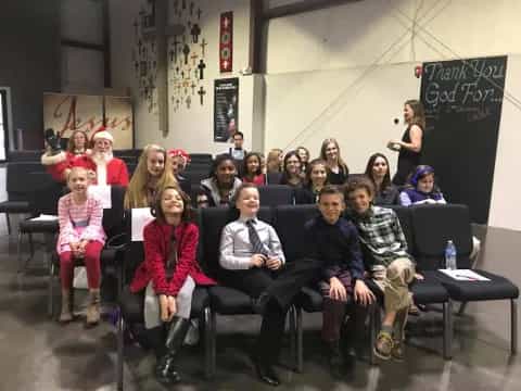 a group of people sitting in chairs