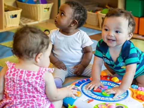 a group of children playing with toys