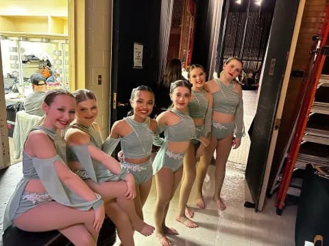 a group of girls posing for a picture