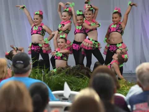 a group of women performing on stage