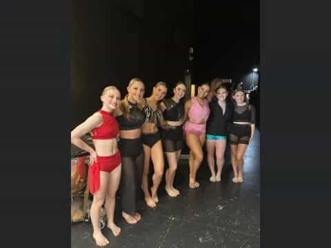 a group of women posing for a photo