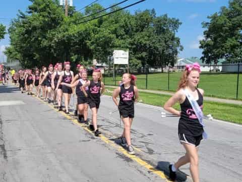 a group of people running on a road