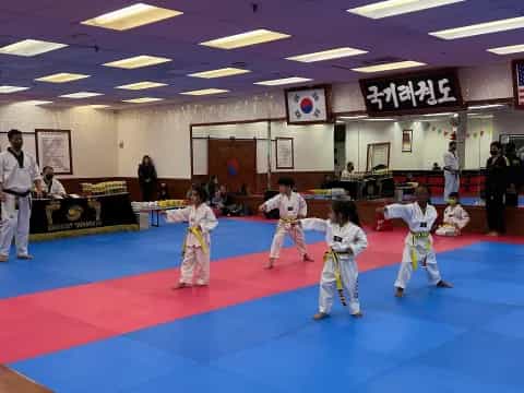 a group of people in karate uniforms