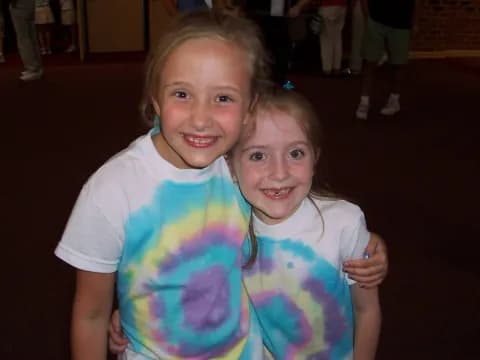 a couple of girls posing for the camera