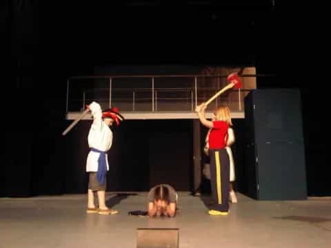 a group of people in clothing on a stage