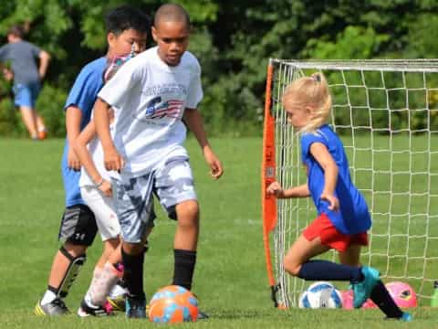 a group of kids playing football