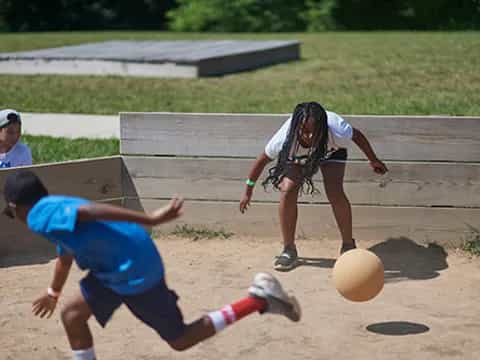 a couple of people playing volleyball