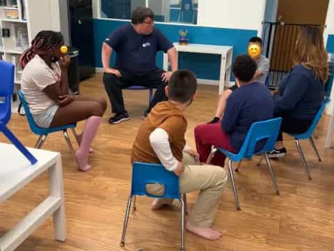 a group of people sitting in chairs