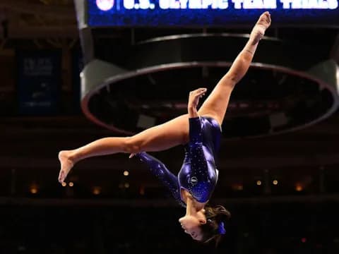 a man doing a handstand on a stage