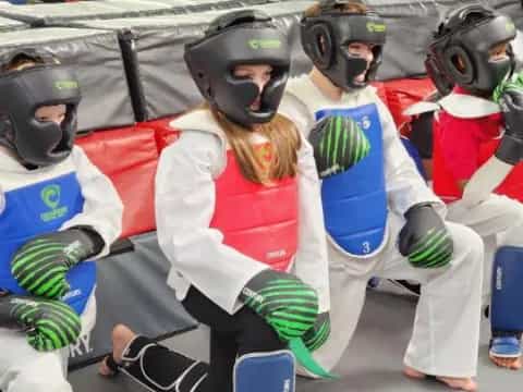 a group of people in a martial arts class