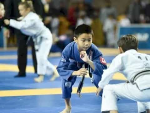 a group of people in karate uniforms