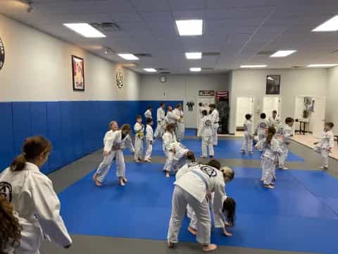 a group of children in a karate class