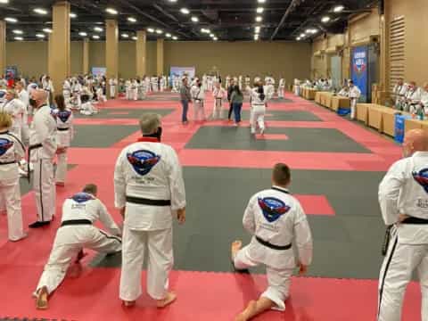 a group of people in karate uniforms