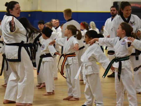 a group of people in karate uniforms