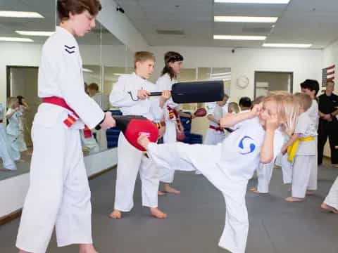 a group of people in karate uniforms
