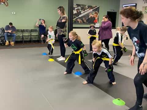 a group of kids playing with balls