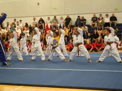 a group of people in karate uniforms