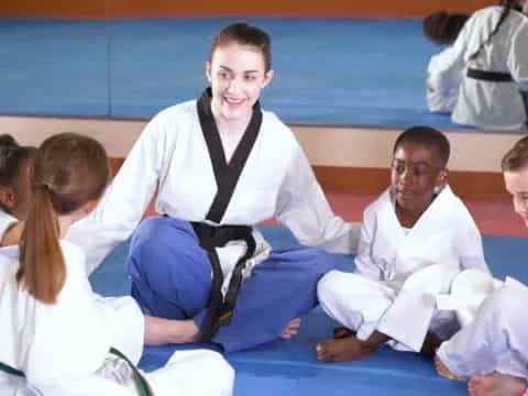 a group of people in karate uniforms