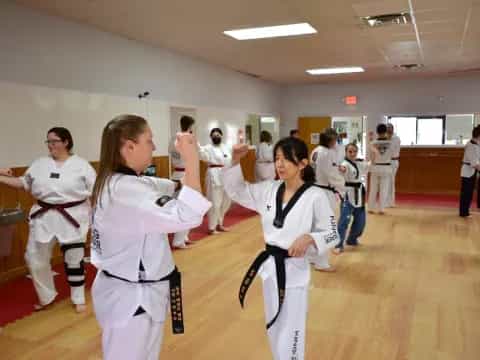 a group of people in karate uniforms